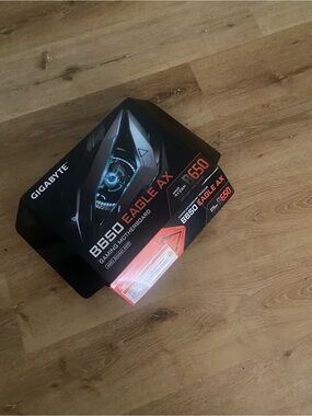 GIGABYTE B650 EAGLE AX Box - Black with Orange Accents and Blue Detail